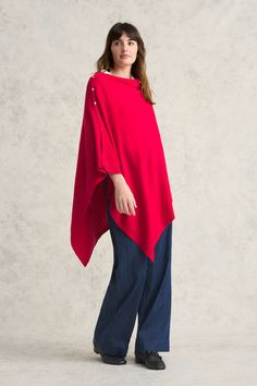 This poncho wrap is made from a luxurious blend of Australian Merino wool and cotton in rich Rouge. Both lightweight and warm, it is the perfect transeasonal layering piece for cooler days and nights. Adorn your poncho with your favourite whimsical brooch et voilà! Chic One-size Cape Poncho, Chic One Size Cape Poncho, One Size Cape For Layering, Winter Shawl Cape For Layering, Oversized Cashmere Cape With Long Sleeves, Oversized Wool Poncho For Layering, One Size Cashmere Poncho For Layering, One Size Cashmere Poncho For Fall, Wool Long Sleeve Poncho For Layering