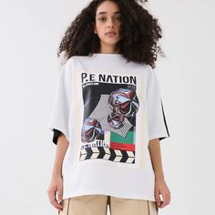 Pe Nation Manifesto Tee In Optic White Msrp $150 Nwt, Perfect Condition Size S Oversized Fit 100% Organic Cotton Sporty White Printed T-shirt, Urban Outfitters White T-shirt With Graphic Print, Urban Outfitters White Graphic T-shirt, Urban Outfitters White Graphic Print T-shirt, Urban Outfitters White Letter Print T-shirt, Oversized Graphic Print Top From Urban Outfitters, Urban Outfitters Graphic Print Tops For Streetwear, Urban Outfitters White T-shirt For Streetwear, White Oversized Tops With Letter Print