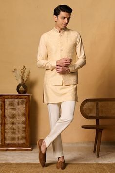 Yellow bundi with thread embroidered floral motifs and placed sequin bead embellishments. Comes with inner kurta and pant. - Aza Fashions Embroidered Nehru Jacket For Reception, Straight Shape, Nehru Jacket With Floral Embroidery For Reception And Festivals, Floral Embroidered Nehru Jacket For Reception And Festivals, Embroidered Nehru Jacket For Reception, Floral Embroidered Nehru Jacket For Festivals And Receptions, Festival Nehru Jacket With Floral Embroidery For Reception, Festive Nehru Jacket With Floral Embroidery And Stand Collar, Eid Kurta With Floral Embroidery And Stand Collar, Bandhgala With Chikankari Embroidery For Eid