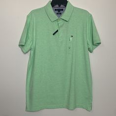 New With Tag Tommy Hilfiger Slim Fit Color: Light Green Mens Wear Polo Shirt - Large 2 Button Closure Side Slits Laying Flat New Tommy Hilfiger Mens Wear Blue Sweater - Large Measurements: Top Of Collar To Hem: 31” Shoulder Seam To Seam: 18” Armpit To Armpit: 22” Green Collared Polo Shirt With Button Closure, Solid Spring Polo Shirt With Button Closure, Solid Polo Shirt With Button Closure For Spring, Casual Spring Polo Shirt With Button Closure, Tommy Hilfiger Green Cotton Tops, Casual Green Tommy Hilfiger Tops, Green Casual Polo Shirt For Spring, Fitted Green Polo Shirt For Spring, Casual Tommy Hilfiger Tops With Buttons