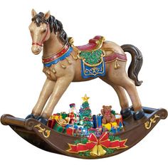 a wooden rocking horse with christmas decorations on it