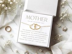 mother on my wedding day bracelet with two interlocked hearts in the middle, surrounded by flowers