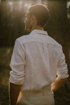 "Our men's linen shirt is handcrafted to fit your individual body measurements. We take pride in the fact that there are no factory processes involved in making our linen (flax) clothes for men. Each men's linen shirt is made with care and attention to detail. DESCRIPTION. This Casual Linen Shirt (wedding shirt) - a true embodiment of minimalism and timeless elegance. Made from the finest Baltic linen. Handcrafted with attention to details. A perfect blend of comfort, simplicity and style.  This Mens Linen Wedding Outfit, Men Wedding Outfit Casual Groom Attire, Groom Casual Wedding Attire, Linen Clothes For Men, Mens Linen Shirts Casual, White Linen Shirt Men, Wedding Attire For Men, Casual Linen Shirt, Casual Groom