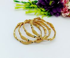 ❖ ❖ ❖ Features: ❖ An Indian styled Meenakari Bangles. ❖ Made from fine Quality Brass with Gold Platting. ❖ Ready to be given as a gift. ❖ Easy and Convenient way to Wear. ❖ It looks prettier than the images. Direct Images on hand is also attached. Size of Bangle & Other Details: ❖ Size:- You Choose ❖ Quantity:- One Pair ❖ Material:- Fine Quality Brass with Gold Platting  This gold plated unique bracelet is glamorously impressive, yet subtle, the design is clean and extremely accurate and suited to any kind of event, both formal and informal, featuring an amazing meenakari, this is one of my favorite items!  It looks beautiful, is durable & also affordable. These bangles is designed for all age groups from office going girl to a housewife. Featuring an exquisite design, these bangles will g Traditional Multicolor Bracelets For Marriage, Ceremonial Gold Bracelets With Motifs, Traditional Bracelets For Marriage, Traditional Marriage Bangle, Gold Bracelets With Motifs For Gift, Gold Bracelets With Motifs As Gift, Gold Bracelet With Motifs As Gift, Bohemian Gold Bangle With Cutdana, Gold Bohemian Bangle For Puja