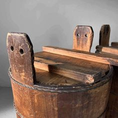 an old wooden barrel with two benches on it's sides and one bench at the top