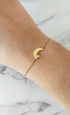 14K Gold Moon Star Bracelet, Solid gold bracelet, Dainty gold bracelet, Crescent moon bracelet, Gift for her, Star bracelet, Rose Gold Moon and Star bracelet, 9K Moon and star Bracelet, FREE EXPRESS SHIPPING Beautiful and delicate bracelet with a crescent moon and star charm made in 14K or 9K solid gold. Remember to reach for the moon and the stars, and they won't be able to resist flying into your hands! Whsiper...To the moon and back! -------------------------------------------------- D E T A Dainty Moon Shaped Bracelets As Gift, Dainty Crescent Bracelet As Gift, Dainty Crescent Bracelet For Gift, Gold Celestial Charm Bracelet As A Gift, Gold Moon-shaped Bracelets As Gift, 14k Gold Star-shaped Bracelet Gift, Gold Moon-shaped Bracelets For Gifts, 14k Gold Star Bracelet Gift, Gold Moon-shaped Bracelet For Gift