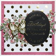 a close up of a card with a butterfly on it and polka dots around the edges