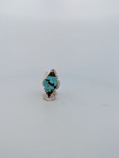 New Native American handmade ring with turquoise inlay and sterling silver, split shank. Made by Navajo Brandon Itatty Discover the artistry of Native American jewelry with this exquisite handmade sterling silver ring. Crafted by renowned Navajo artist Brandon Itatty, this piece features intricate turquoise inlay work and a split shank design. The unique combination of materials and craftsmanship make it a truly special and one-of-a-kind accessory. Perfect for adding a touch of Southwestern eleg Artisan Silver Turquoise Ring With Inlay, Artisan One-of-a-kind Blue Turquoise Ring, Nickel-free Round Southwestern Turquoise Ring, Unique Nickel-free Sterling Silver Turquoise Ring, Sterling Silver Rings Turquoise, Handmade Sterling Silver Rings, Adjustable Southwestern Turquoise Ring Nickel-free, Turquoise Ring Silver, Native American Jewelry