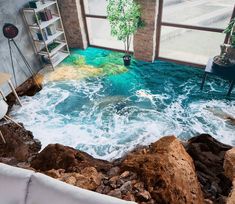 a living room filled with rocks and water