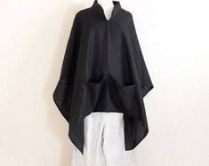 "free size heavy linen swallow poncho coat with big pockets / black linen poncho / plus size linen poncho / linen cape / linen coat / poncho This is a made to order listing. Please mention heavy linen color you prefer when check out. Thank you! heavy linen nice weight great for cool weather long and wide poncho with 2 pockets in the front. super roomy and comfy elegant chipao collar so versatile that you can slide the poncho in different angles yet it still looks great! length 29\" free size tha Long Linen Skirt, Kimono Sleeve Top, Plus Size Linen, Poncho Coat, Linen Coat, Ladies Poncho, Linen Tank Top, Big Pockets, Linen Jackets