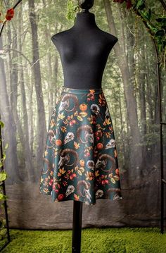 This beautiful skirt is made with our special pattern.  The fabric is a stretch strong scuba knit with our own design printed on it. Very confy and soft.  The skirt is stretchy so will acomodate very nice to your body. Length front: 60cm approx Meassurements in the waist: XSmall: 66cm (without stretching) Small-Medium: 74cm (without stretching) Medium-Large: 88cm (without stretching) Fitted Black Printed Skirt, Autumn Cottage, Halloween Skirt, Cottage Witch, Scuba Knit, Black Witch, Beautiful Skirt, Beautiful Skirts, Skater Skirt