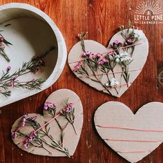 three heart shaped paper hearts with flowers on them