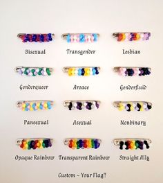 a bunch of different colored hair clips on a white surface with words written below them