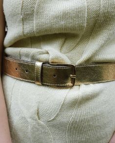 This metallic leather belt for women is sleek & sensational. Featuring a minimal silver buckle on both the black belt and silver belt and a gold buckle on the gold belt, the strap on this belt is where all the actions at. Shine your way from day to night in this fun fashion accessory. Classic leather belts are investment pieces for your forever wardrobe because they match with jeans, shorts, jumpers, & dresses. The carefully sewn trim around this premium leather belt is proof of that Amsterdam H Chic Party Belt With Gold Buckle, Chic Adjustable Belt Buckles For Party, Chic Gold Belt For Party, Trendy Gold Party Belt, Gold Belt Buckles For Work, Chic Gold Belt For Evening, Trendy Party Belt With Removable Feature, Trendy Party Belt With Removable Buckle, Trendy Adjustable Gold Belt