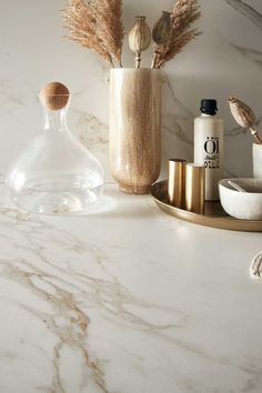 a marble counter top with various items on it