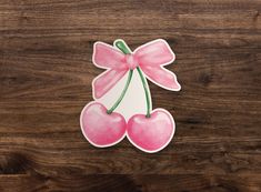 a cherry sticker sitting on top of a wooden table