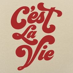 red lettering on white paper that says, est la vie