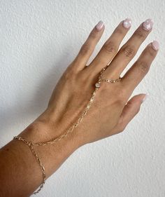 Hand Chain Ring Bracelet, CZ Stone, Rolo Link Chain, Bridal Dainty Bracelet, Finger Link Ring Chain, Mothers day 2024 gift Description: * Material: 18K Gold Filled * Quantity: Finished Bracelet * Length: Bracelet Size (6 3/4' Inch) + 2" EXT * Length (Wrist to finger): 4' Inch * Thickness: 2mm * Color: Gold **HOW TO CARE FOR YOUR JEWELRY *Maintain your jewelry's high shine by avoiding contact with any chemicals such as soap, perfume, lotion, makeup, hair & cleaning products. *When you do not use the jewelry you bought, you can always keep it in a pouch or box, reducing its contact with oxygen and wearing it for many years with its first day's shine. *You can do your product maintenance with a cotton-soft dry cloth. *You can always be stylish with the products you keep in the boxes sent to y Dainty Adjustable Bracelet Body Jewelry, Dainty Adjustable Body Jewelry Bracelet, Adjustable Dainty Body Jewelry, Adjustable Delicate Chain Body Jewelry As Gift, Adjustable Delicate Chain Body Jewelry For Gift, Adjustable Delicate Chain Body Jewelry For Wedding, Delicate Adjustable Gold Body Jewelry, Dainty Chain Body Jewelry For Wedding, Resizable Rose Gold Bracelet