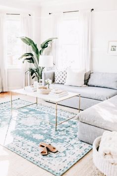 a living room filled with furniture and a rug