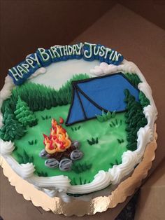 a birthday cake with a camping theme on it