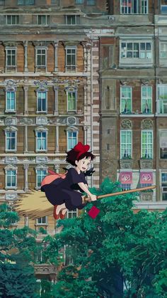 a woman flying through the air while riding on top of a broom in front of a tall building