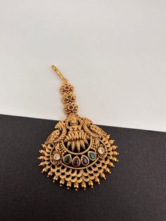 Goddess Lakshmi Matte Finish Maang tikka Perfect Mang tikka for complete traditional trendy look. Length : Approx. 3.75 inches Premium quality and craftmanship. Satisfaction Guaranteed.  Ready to ship from Massachusetts, USA If you have any questions please let me know. Festive Kundan Tikka For Rituals, Kundan Tikka For Diwali Rituals, Temple Jewelry Tikka With Latkans For Eid, Bollywood Style Tikka For Rituals With Intricate Design, Bollywood Style Tikka With Intricate Design For Rituals, Ceremonial Tikka With Intricate Design For Eid, Elegant Zari Work Tikka For Puja, Bollywood Style Festive Ritual Tikka, Bollywood Style Tikka For Diwali Rituals