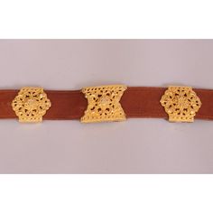 This supple brown leather belt is embellished with a large gold toned buckle and seven decorative slides in two different styles. The belt is stamped  Made in Italy by Roberta Di Camerino Expressly for Saks Fifth Ave. It is in excellent condition and appears unworn. Measurements; Belt  Length 32" Width 1 3/8" Buckle Height 5"  Please see the measurements noted above in the description for best approximate dimensions Robert Lee Morris, Suede Belt, Brown Leather Belt, Stamp Making, Blue Suede, Donna Karan, Leather Belt, Gold Tone Metal, Different Styles