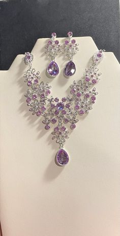 "Purple Crystal Jewelry set , Purple Crystal Rhinestone Necklace & Drop Earrings Set , Silver , Purple Bridal jewelry set Beautiful Necklace is 19 3/4 \" Long + 4 1/4 \" ext. Matching Earrings are 2 \" Long. Round Crystals throughout the necklace and finished with a Teardrop Crystal. Please ask question as I do not accept returns! Thank You!" Purple Crystal Earrings, Purple Gem Jewelry, Purple Jwellary, Silver Jewelry Set Wedding, Purple Necklace Crystal, Purple Jewellery Set, Earing And Necklace Set, Purple Diamond Necklace, Crystal Jewelry Ideas