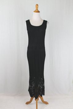 "Vintage Krochetta by Papillon Long Sleeveless Black Crocheted Dress  1920's inspired black crocheted gown Sleeveless with a scoop neck and back 100% Rayon, fully lined with  stretchy jersey Size Petite Large Measurements taken unstretched Bust 36\" Waist 34\" Hips 38\" Length 54\"  Shoulder to hem 63\" Shoulders 16\" Condition: Excellent  condition" Fitted Sleeveless Lace Maxi Dress, Fitted Sleeveless Crochet Dress With Lace Trim, Sleeveless Stretch Lace Maxi Dress, Stretch Lace Sleeveless Maxi Dress, Fitted Sleeveless Crochet Evening Dress, Sleeveless Crochet Dress For Spring Evenings, Black Sleeveless Lace Crochet Dress, Black Sleeveless Crochet Evening Dress, Black Fitted Crochet Dress With Lace Trim