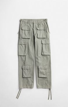 Step into comfort and functionality with the Cotton Cargo Pants from RC Outdoor Supply. Designed with adjustable side tabs, a zip fly closure, and cargo pockets throughout, these pants offer ample storage for your essentials. The drawcord leg hems and wide leg openings enhance the baggy, relaxed fit, making them ideal for any adventure or everyday wear.20" leg opening32" inseam10.75" riseAdjustable side tabsCargo snap-button pockets throughoutSide zipper slant pocketsSoft-touch metal coated hookSignature rock 4-hole button closureBranded clasp for twill tape adjusters at waistbandTwill tape at the bottom hemDrawcord leg hemsBaggy relaxed fitWide leg openings100% cottonHand washMeasurements taken from a size 32 RC Outdoor Supply Mens Cotton Cargo Pants - Sage size 34W 31L Functional Straight Leg Parachute Pants With Cargo Pockets, Functional Wide-leg Cargo Pants With Multiple Pockets, Functional Straight Leg Cargo Pants, Functional Straight Leg Parachute Pants With Multiple Pockets, Functional Tapered Leg Cargo Pants, Functional Parachute Pants With Multiple Pockets, Functional Wide-leg Cargo Pants With Side Pockets, Functional Straight Leg Pants With Cargo Pockets, Functional Straight Leg Pants With Pockets