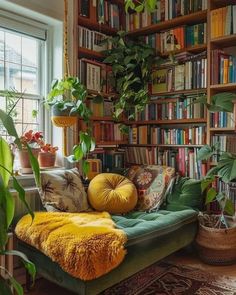 a living room filled with lots of green plants and bookshelves full of books