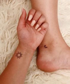 a woman with a small sun and moon tattoo on her foot