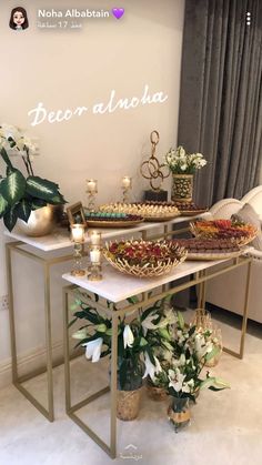 a table topped with lots of desserts and flowers