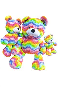 a multicolored teddy bear with two smaller ones