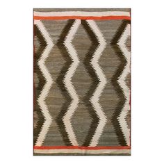 a brown and white rug with an orange stripe on the bottom, in front of a white background