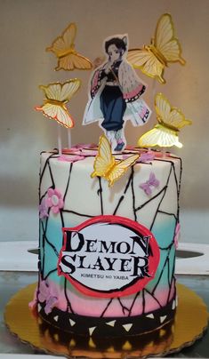 a cake decorated with an image of a woman and butterflies