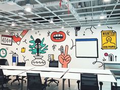 an empty conference room with painted walls and black chairs