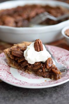 a slice of pecan pie with whipped cream on top