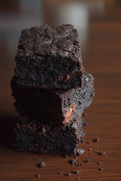 three chocolate brownies stacked on top of each other