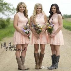 three beautiful young women standing next to each other on a dirt road wearing cowboy boots