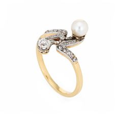 Finely detailed antique Edwardian diamond & pearl ''moi et toi'' ring crafted in 18k yellow gold (circa 1910s).    The old cushion cut diamond is estimated at 0.25 carats, accented with a further 23 estimated 0.01 carat rose cut diamonds. The total diamond weight is estimated at 0.48 carats (estimated at J-K colour and I1-2 clarity). The pearl measures 5.3mm.   The distinct and stylish ring is a great example of Edwardian era jewellery. The two stone diamond & pearl ''Moi et Toi'' design is a Fr Formal Yellow Gold Pearl Ring With Rose Cut Diamonds, Heirloom Yellow Gold Diamond Pearl Ring, Heirloom Yellow Gold Pearl Ring With Diamond, Antique Yellow Gold Pearl Ring With Rose Cut Diamonds, Vintage Gold Pearl Ring With Rose Cut Diamonds, Formal 14k Gold Pearl Ring With Rose Cut Diamonds, Classic Pearl Ring With Rose Cut Diamonds For Anniversary, Victorian Pearl Ring With Gold And Diamond, Victorian Yellow Gold Pearl Ring With Rose Cut Diamonds