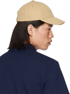 Cotton canvas cap in beige. · Embroidered eyelets at crown · Logo embroidered at face · Curved brim · Cinch fastening · Twill lining Supplier color: Dark beige Beige Baseball Cap With Curved Visor, Classic Beige Visor Dad Hat, Beige Six-panel Baseball Cap With Embroidered Logo, Beige Embroidered Logo Six-panel Baseball Cap, Classic Beige Dad Hat With Curved Visor, Beige Embroidered Visor Hat, Beige Six-panel Hat With Embroidered Logo, Crown Logo, Dark Beige