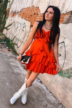 This bright red ruffle dress is a must have for specials events + game days! Pair this cutie with tall boots for tailgating, or heels for an elegant party look! This dress features adjustable straps, padding in the top, ruffles along the bottom, and a cutie bow on the torso area! The back has elastic stretch so it keeps you comfy while you wear it! 94% polyester, 6% spandex Claudia is in size S lined v-neck Southern Roots Boutique112 W. Main St. Paragould, AR Red Mini Dress With Ruffled Straps For Party, Red Flirty Dress With Ruffled Straps, Red Ruffle Dress For Party, Red Ruffle Hem Dress For Party, Red Party Dress With Ruffled Skirt, Flirty Red Dress With Ruffled Skirt, Flirty Red Dress With Ruffle Hem, Red Ruffle Dress For Summer, Flirty Red Mini Dress With Ruffles