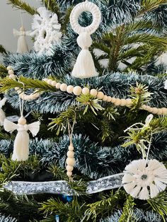 a christmas tree with ornaments hanging from it