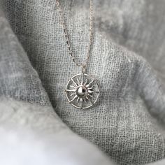 "Beautiful and lovely silver sun pendant necklace. Made of sterling silver dipped sun pendant with skinny chain. Soft and simple. Great for gift, every day or special occasion. Your item will ship in a gift box. Please feel free to contact me if you have any questions. ♥ Chain length 14\" 18\" ♥ Pendant 5/8\" ♥ Sterling Silver Dipped ♥ Creation Time: 1 - 3 days ♥ See more Rudiana Accessories Rudiana.etsy.com" Silver Sun Necklace, Silver Sterling Silver Necklace With Sun Design, Silver Dainty Charm Necklace With Sun And Moon Design, Silver Sun Necklace With Sun And Moon Design, Silver Necklace With Sun And Moon Design, Sterling Silver Necklace With Sun Design, Sterling Silver Sun Design Necklace, Silver Sun Design Jewelry As A Gift, Silver Sun Design Necklace For Gift