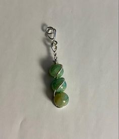 ✧NEW STORE SALE - GRAND OPENING✧ ♡ Find all of my Handmade jewelry and unique pieces wrapped by me discounted for this short time ♡ I personally make each piece in-house. Each piece of jewelry is wrapped with care and good vibes.  Everything is one of a kind. No rock, stone, or gem is the same! Various materials are available. THIS ITEM IS: Green Jade Beaded Necklace, USA Hand Made Silver wire wrapped pendant. Triple beaded design with spiraling silver wire wraps around for a striking design. Hangs Middle/Low on chest. Results may vary depending on your size. Each jade bead will be unique and different than the others creating a One of A Kind look to this necklace.  ✧Gem/Stone dimensions✧ Shown in photos. Beads stack up to around 1IN and the entire pendant is a bit longer than that. Great Jade Bead Necklace, Jade Beads, Green Jade, Gem Stone, Wrapped Pendant, Beads Necklace, Wire Wrapped Pendant, Bead Designs, Grand Opening