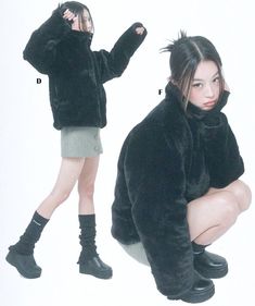 a woman in black jacket and skirt sitting on the ground with her legs crossed, wearing boots