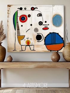 an abstract painting on a wall above a wooden table with vases and planters