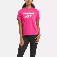 Wear your Reebok pride front and center. This women's t-shirt features a bold Vector logo to go with your sporty style. The single jersey cotton has a breezy feel that keeps you comfy on morning walks and long, lazy afternoons. Cotton Graphic Tee Activewear With Logo, Adidas Logo Workout T-shirt Crew Neck, Adidas Logo Crew Neck Workout T-shirt, Adidas Crew Neck Workout T-shirt, Adidas Workout T-shirt With Crew Neck, Pink Graphic Print Activewear With Crew Neck, Pink Crew Neck Activewear With Graphic Print, Athleisure Text Print T-shirt, Adidas Logo Cotton T-shirt For Gym