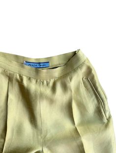 Luxurious chinos in a classic straight leg and high waist fit by Prada. The color is a shifting gold and light lime green color, pockets on sides and zip and button on side. Condition: in great vintage condition Material: 100% silk Size: Italian 46, 36-38 Important Information: All orders are shipped within 2-8 business days of purchase with Tracking. A notification email will be sent with tracking when the order has shipped. Once an item has been shipped, Juno Juno is not responsible for packag Silk Tapered Leg Bottoms With Pressed Crease, Green Silk Wide-leg Bottoms, Green Fitted Silk Pants, Fitted Green Silk Pants, Classic Green Bottoms With Straight Hem, Green Silk Bottoms For Spring, Green Fitted Silk Bottoms, Fitted Silk Green Bottoms, Fitted Green Silk Bottoms